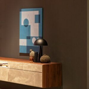 Grey table lamp on wooden sideboard