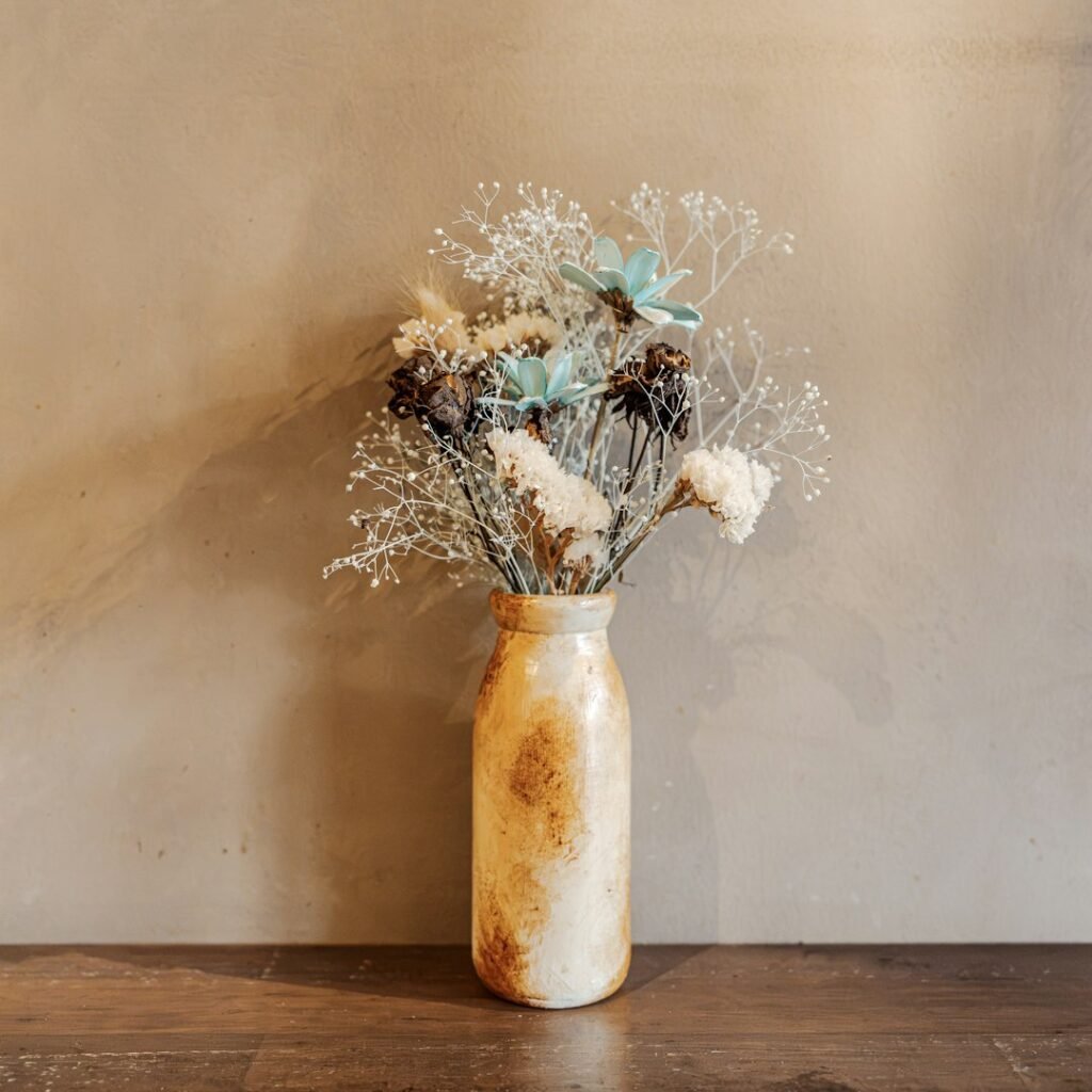 Rustic ceramic vase with dried flowers