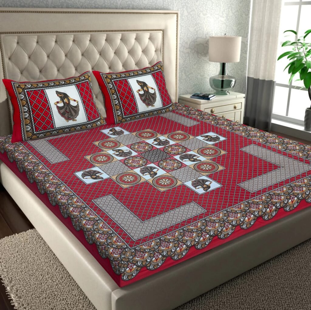 Red double bedsheet with Rajasthani folk dancer tiles in a rangoli layout and dancer pillow covers