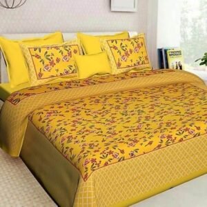 Yellow double bedsheet with red and green floral print and lattice border with matching pillow covers