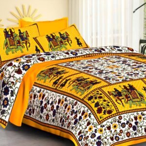 White floral double bedsheet with yellow Rajasthani elephant and rider panels and matching pillow covers