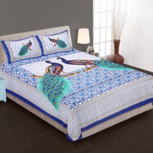 Blue and white double bedsheet with two navy peacocks with sea-green tails and peacock pillow covers