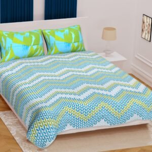 White double bedsheet with aqua blue and lime green leaf chevron print and abstract pillow covers