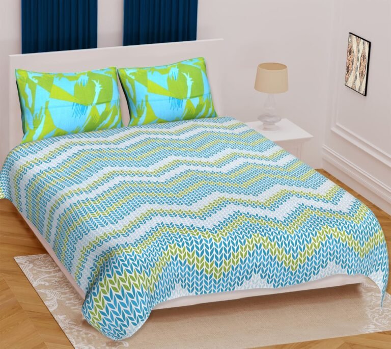 White double bedsheet with aqua blue and lime green leaf chevron print and abstract pillow covers
