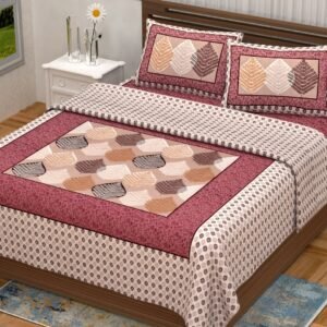 Cream double bedsheet with framed brown and peach leaf panel, maroon floral frame and leaf pillow covers