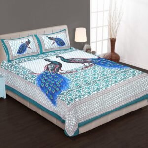 White and teal double bedsheet with two blue-tailed peacocks on a branch and peacock pillow covers