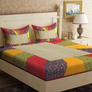 Multicolour patchwork print double bedsheet with red, mustard, green and purple panels and pillow covers