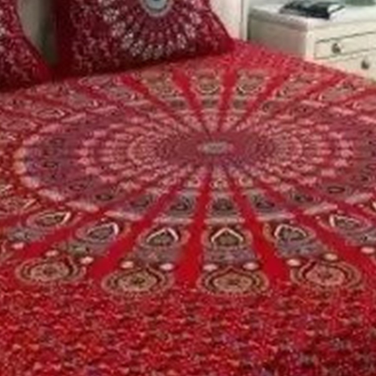 Close-up of the print on the Red Peacock Feather Mandala Double Bedsheet